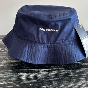 New Balance bucket hat. Navy blue with logos.